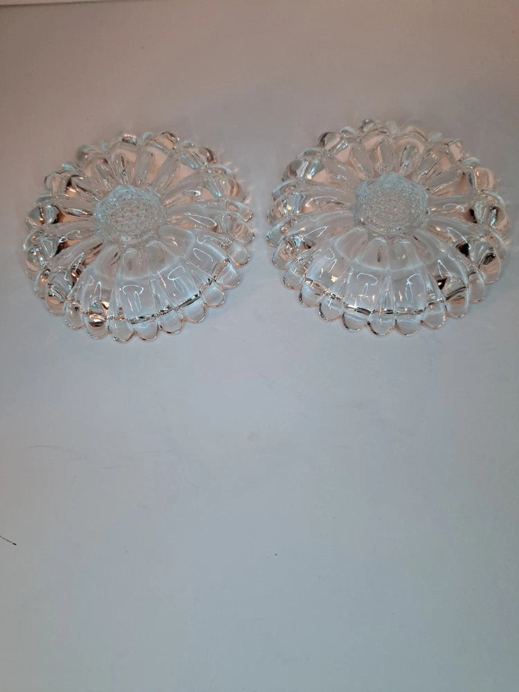 Pair of clear cut-glass flower candle holders with raised sunflower design