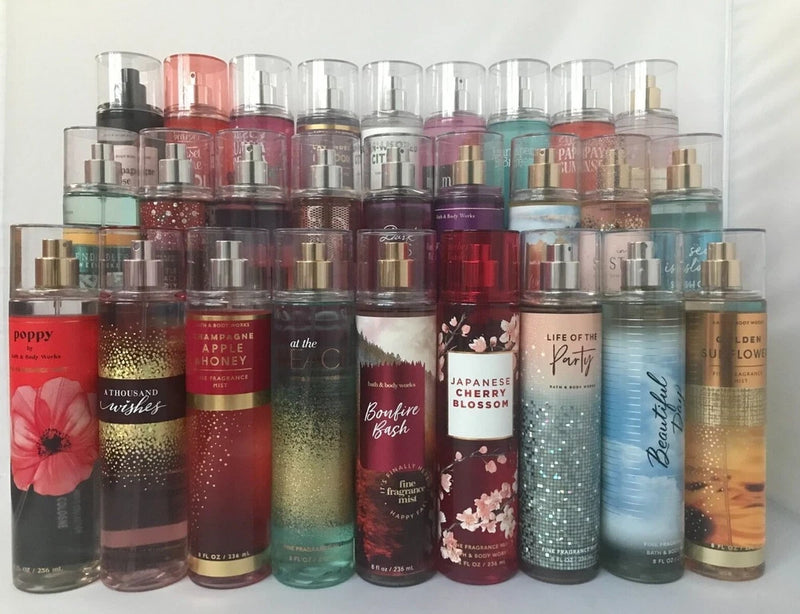 Assorted fine fragrance body mist spray bottles, 8 fl oz size with colored caps