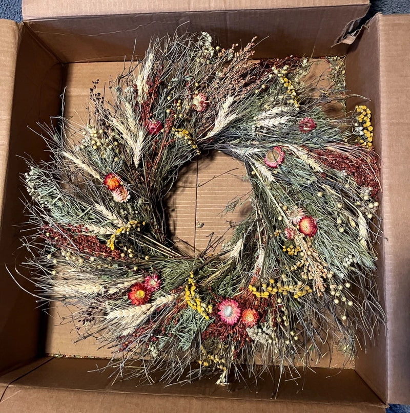 Dried flower wheat wreath with multicolor dried blooms and wispy green stalks