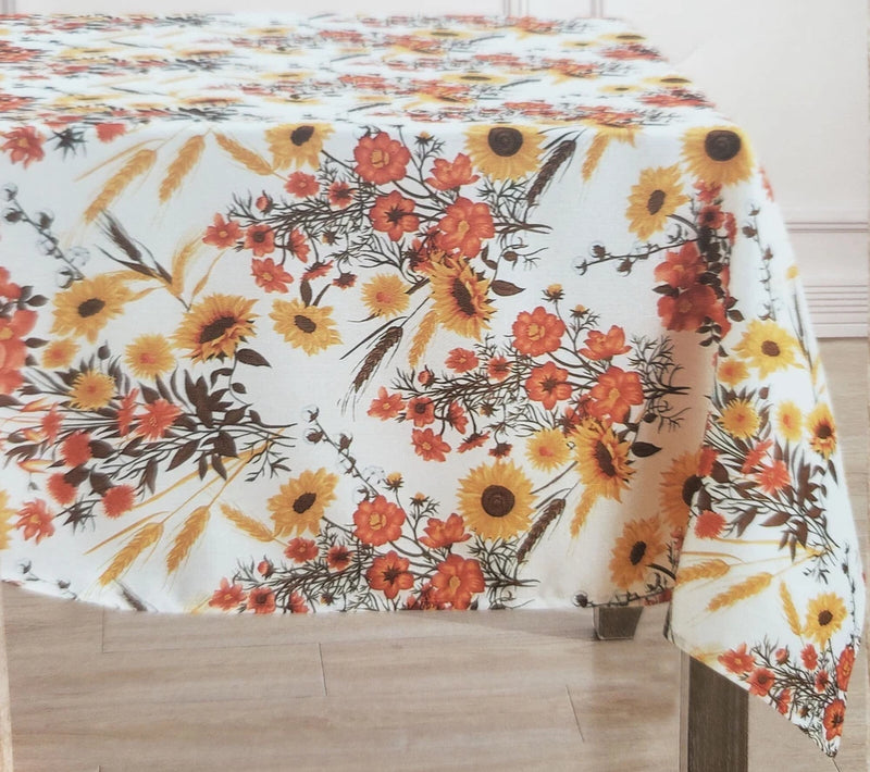 Printed fabric tablecloth with sunflower and orange floral pattern, oblong drape.