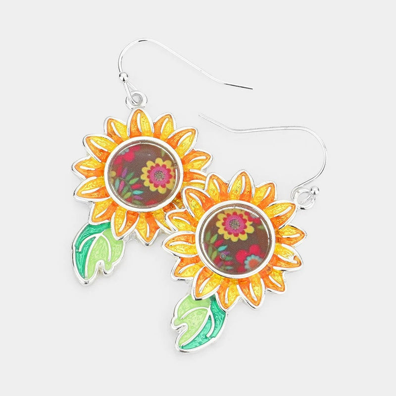 Sunflower hippie color earrings with orange petals, pink centers, green leaves, silver hooks