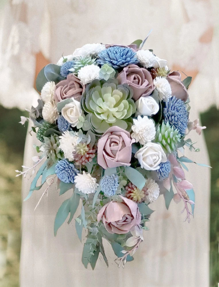 Dusty blue, mauve and white cascading bridal bouquet with roses, succulents, and greenery