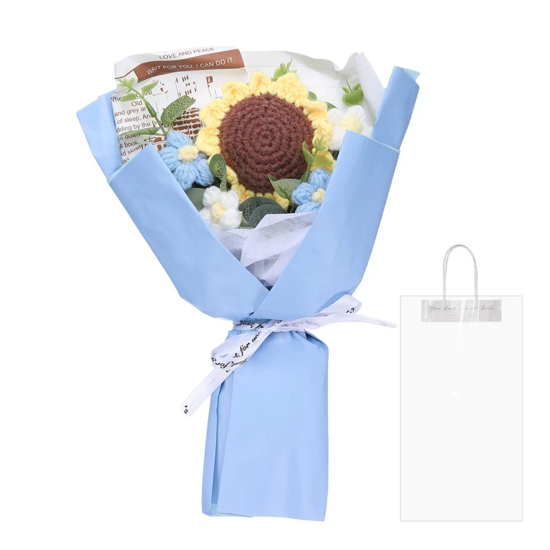 Handmade crochet sunflower bouquet with light blue wrapped flowers and petals, tied ribbon