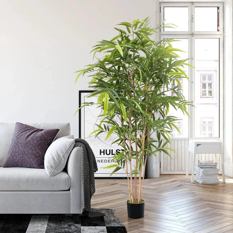 Artificial bamboo tree with green stalks and leaves in black pot