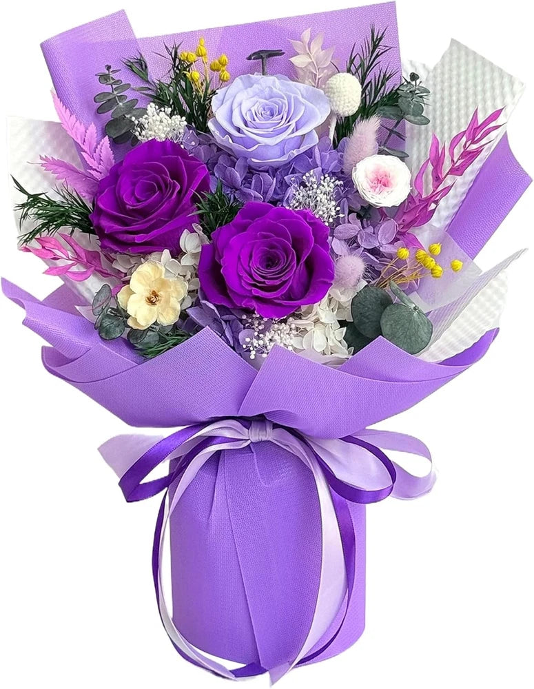 Preserved purple flower bouquet with lavender roses, wrapped in purple gift paper and ribbon