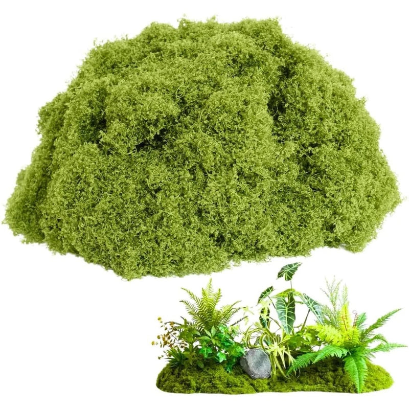 Artificial green faux moss mat with small decorative plants and rocks