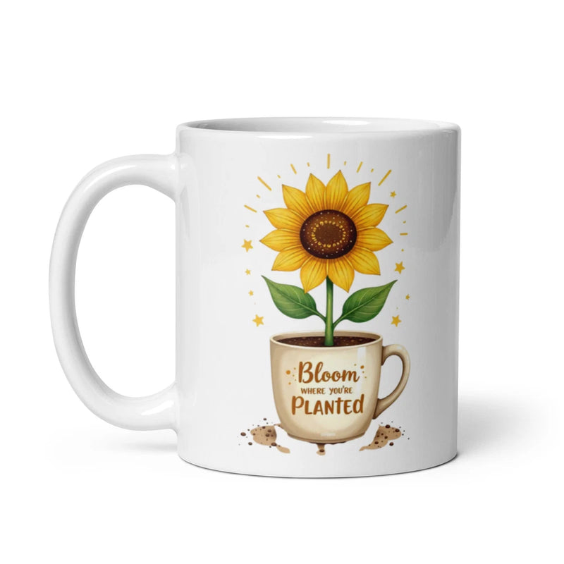 White ceramic mug with sunflower illustration and quote “Bloom where you're planted”
