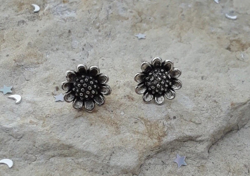Oxidized sunflower stud earrings with dark silver post settings
