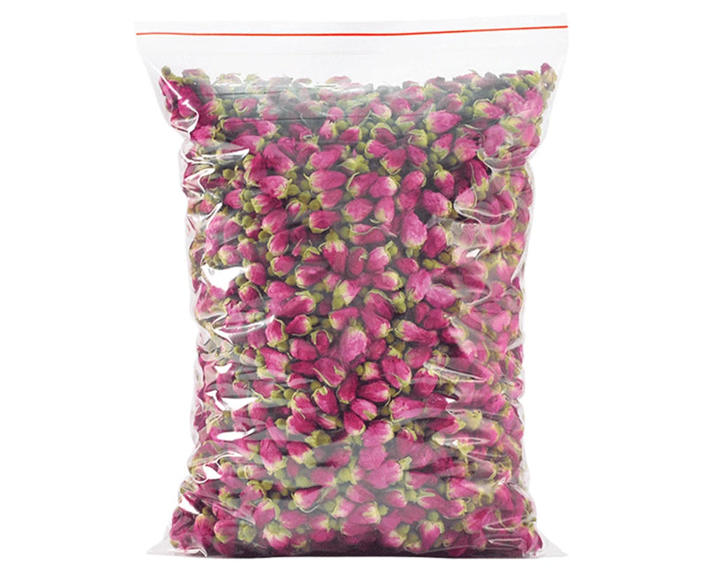 Bag of dried red and pink rose buds for floral herbal tea