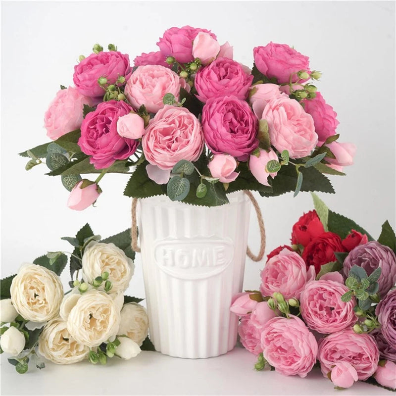 Pink artificial silk peony bouquet with white striped vase marked 'HOME'