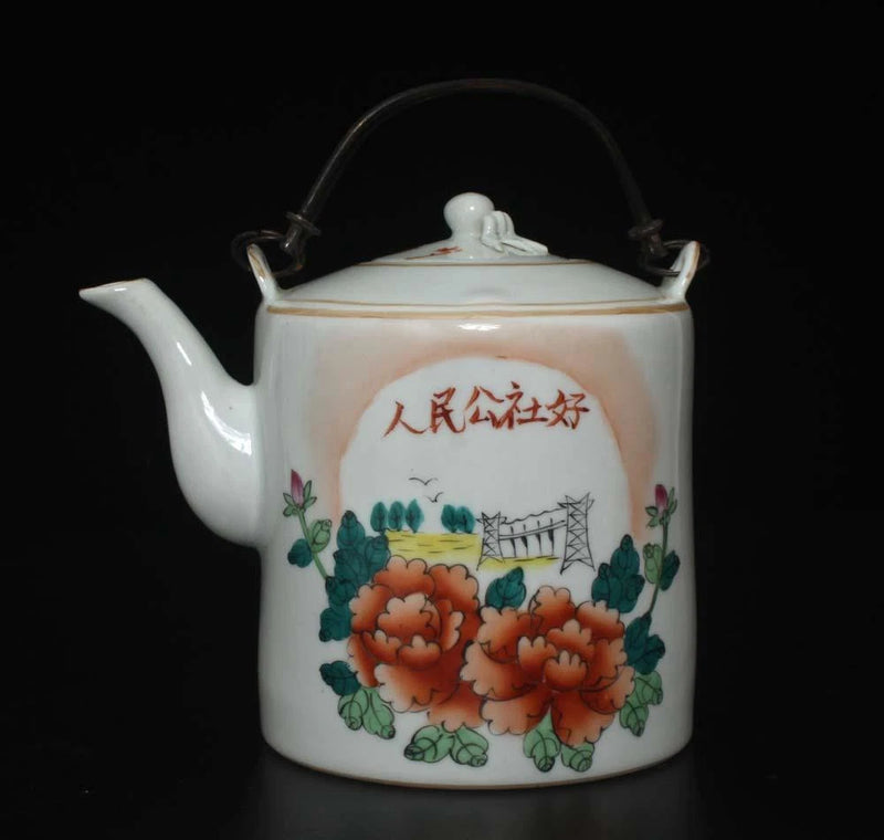 White porcelain teapot with arched handle, signed red character, and peony floral panels