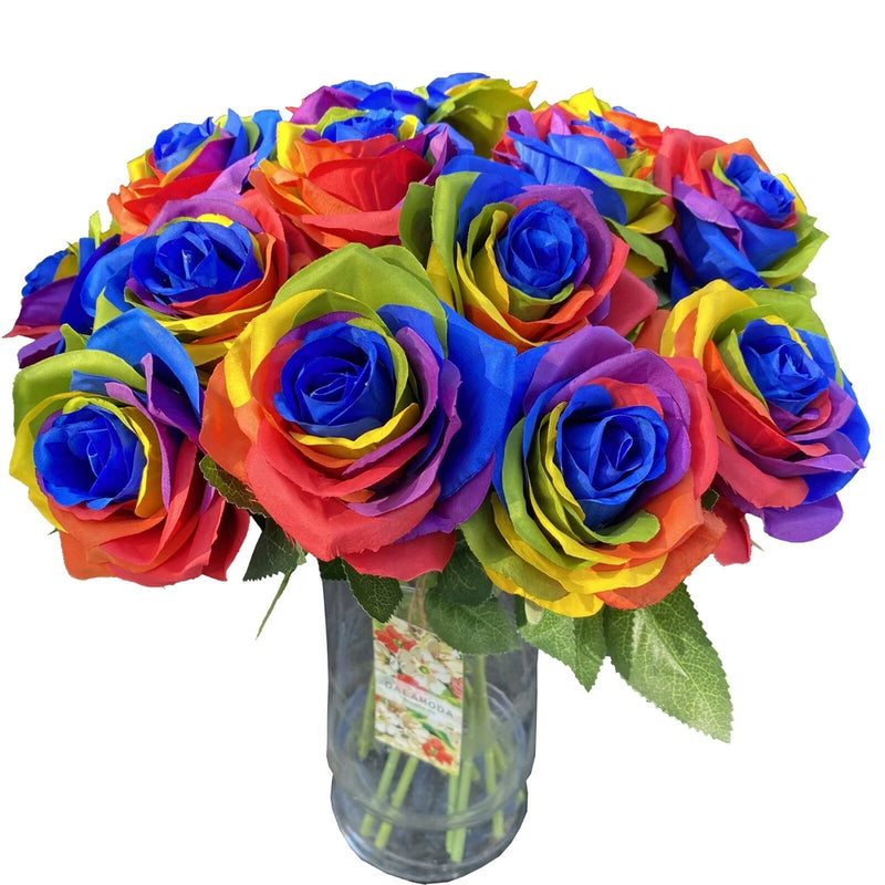 Rainbow artificial silk rose bouquet with multicolor blooms in clear glass vase