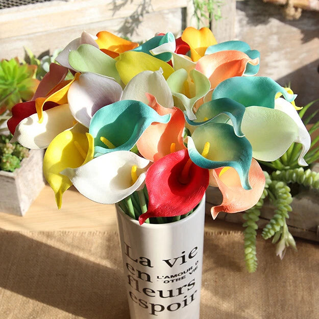 Artificial calla lily flower stem bunch with multicolor blooms in white container