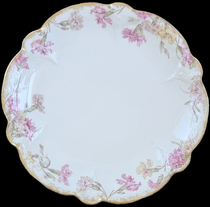 Antique floral porcelain plate with pink carnations and gold scalloped rim, round 10-inch