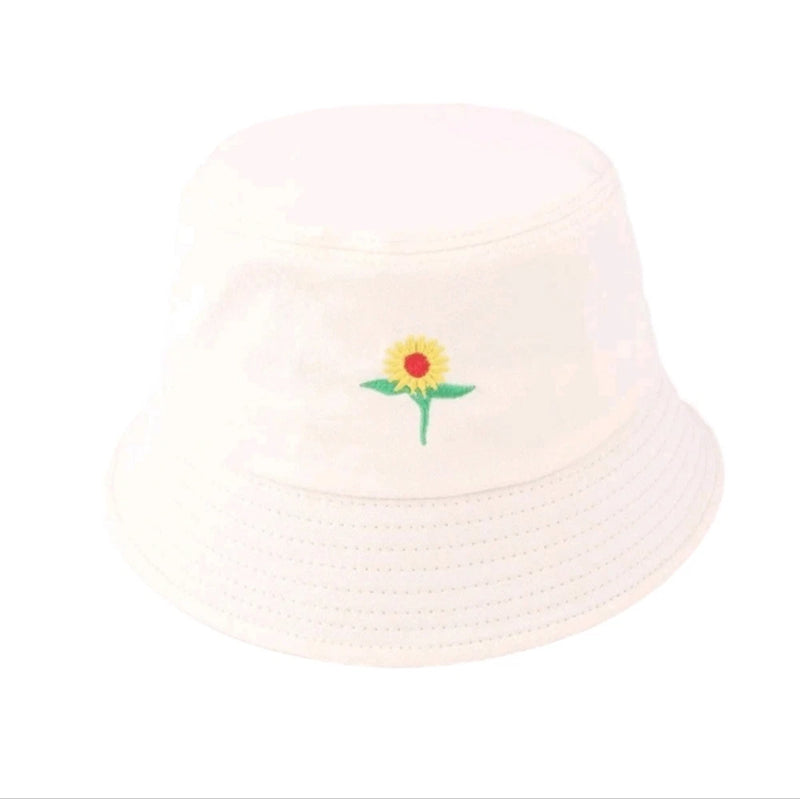 White bucket hat with small sunflower applique on front