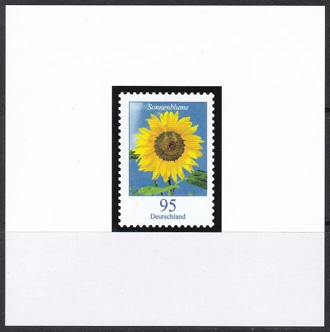 Sunflower postage stamp: yellow flower on blue landscape, 'Sonnenblume' and 95
