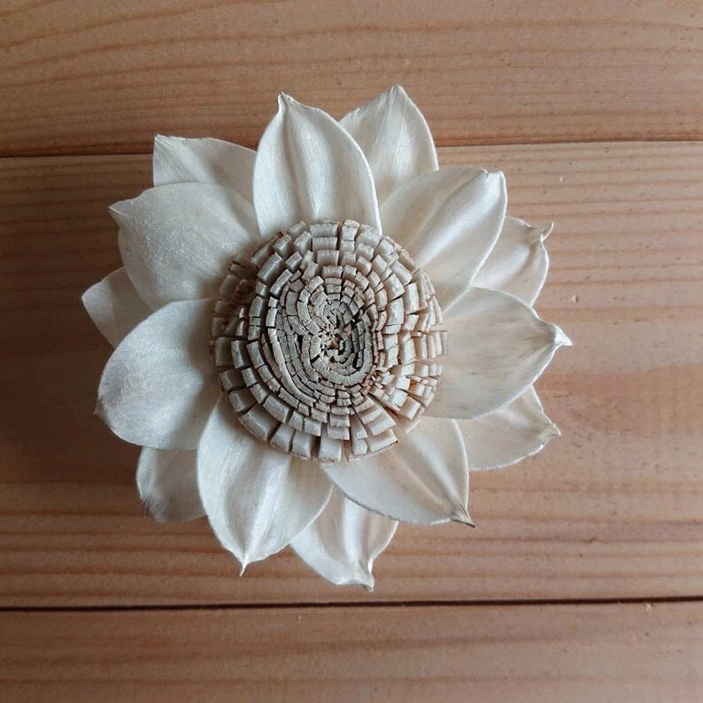 White sola wood flower diffuser with layered petals and woven center