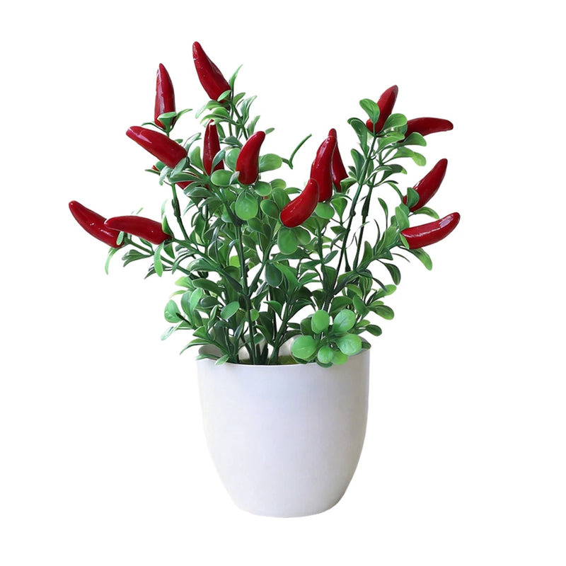 Artificial potted flower plant with red petal-like blooms and green leaves in white pot
