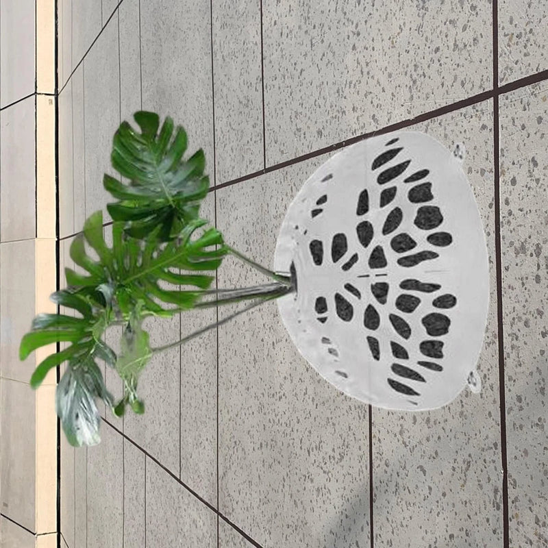 White perforated round floating planter cover with green plant leaves and roots