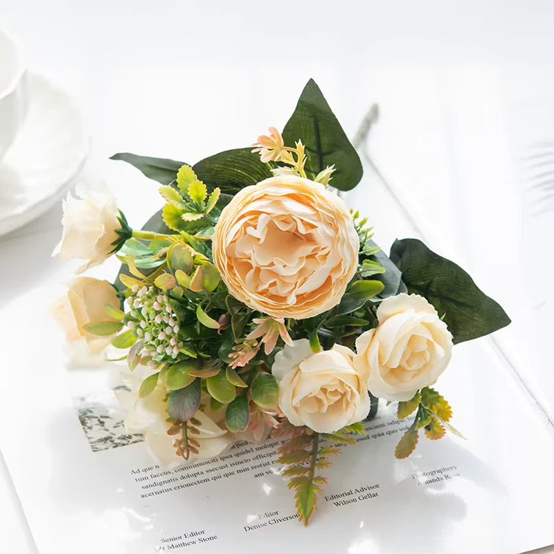 Artificial peony flower bouquet with cream and peach blooms and green leaves
