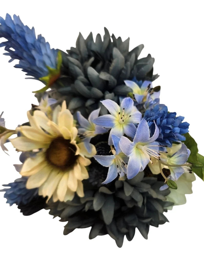 Faux floral bouquet with blue mums, white blossoms, and yellow sunflowers on dark stems