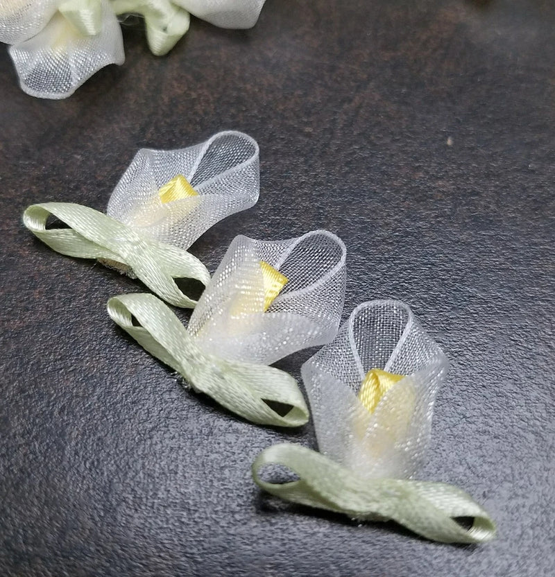 Mini satin ribbon calla lily flowers with yellow centers and green ribbon stems
