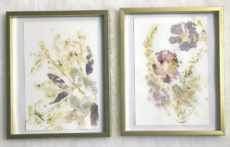 Two-piece framed dried flower wall art with gold frames and pressed blooms