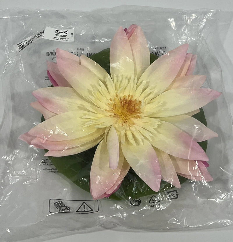 Artificial floating water lily centerpiece with pale yellow petals and pink tips, single flower