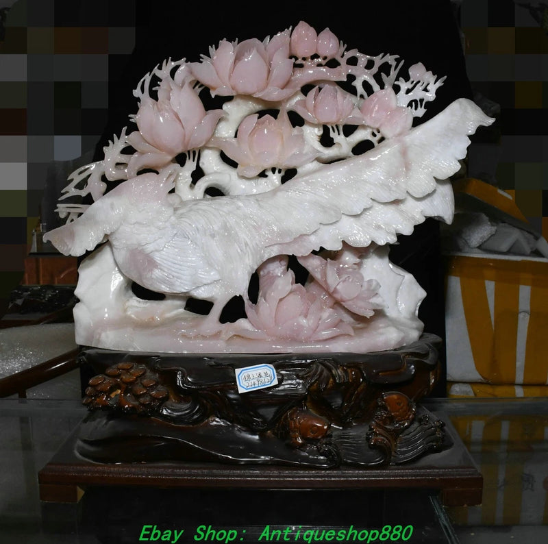 Carved jade bird and peony flower statue, white and pale pink, ornate base.