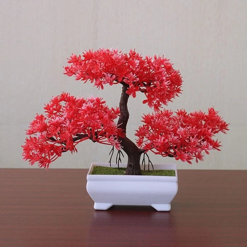 Artificial pine bonsai in white square pot with bright red dried-style blossoms