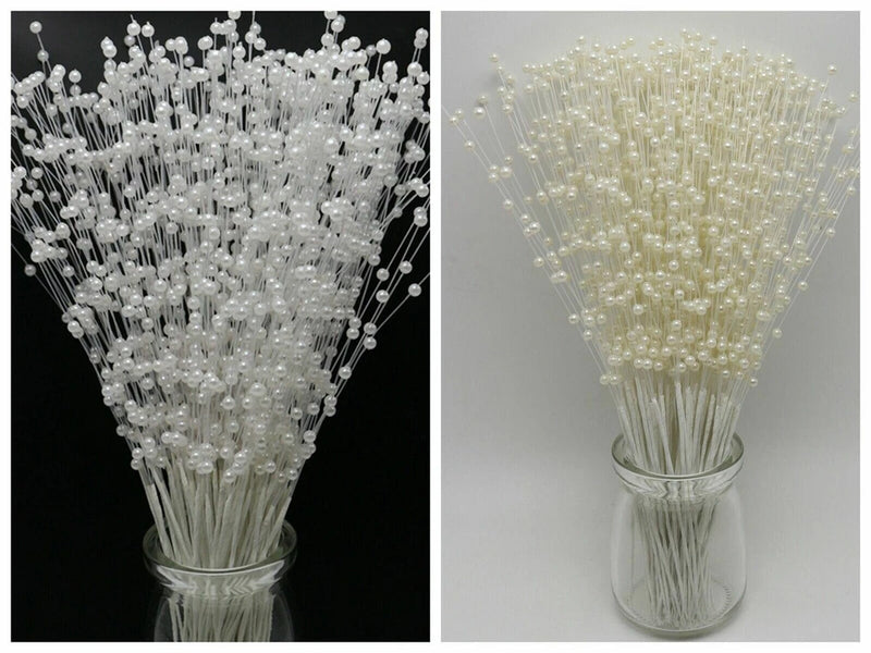 Ivory pearl flower stem bead garland spray with many beaded strands in a vase
