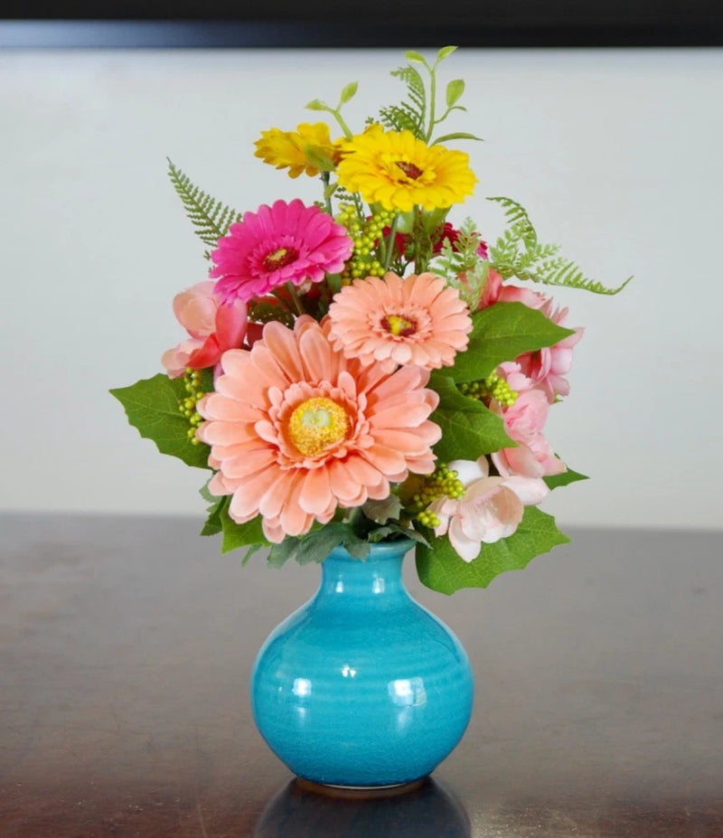 Silk  Peach, Yellow  and Pink Gerbera Daisy Arrangement in Blue Ceramic Vase Ranunculus
