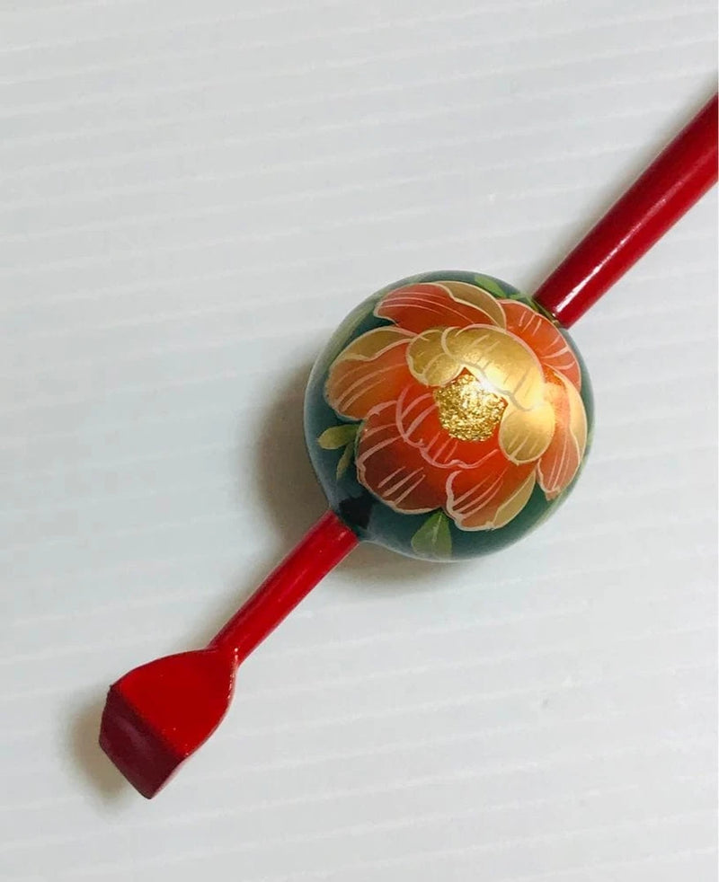 Peony flower ball hairpin with gold and orange floral design, red cord ends