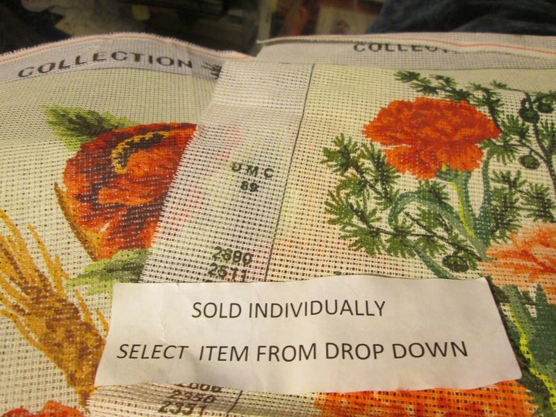 Needlepoint canvas with two colorful flower motifs, printed on beige mesh
