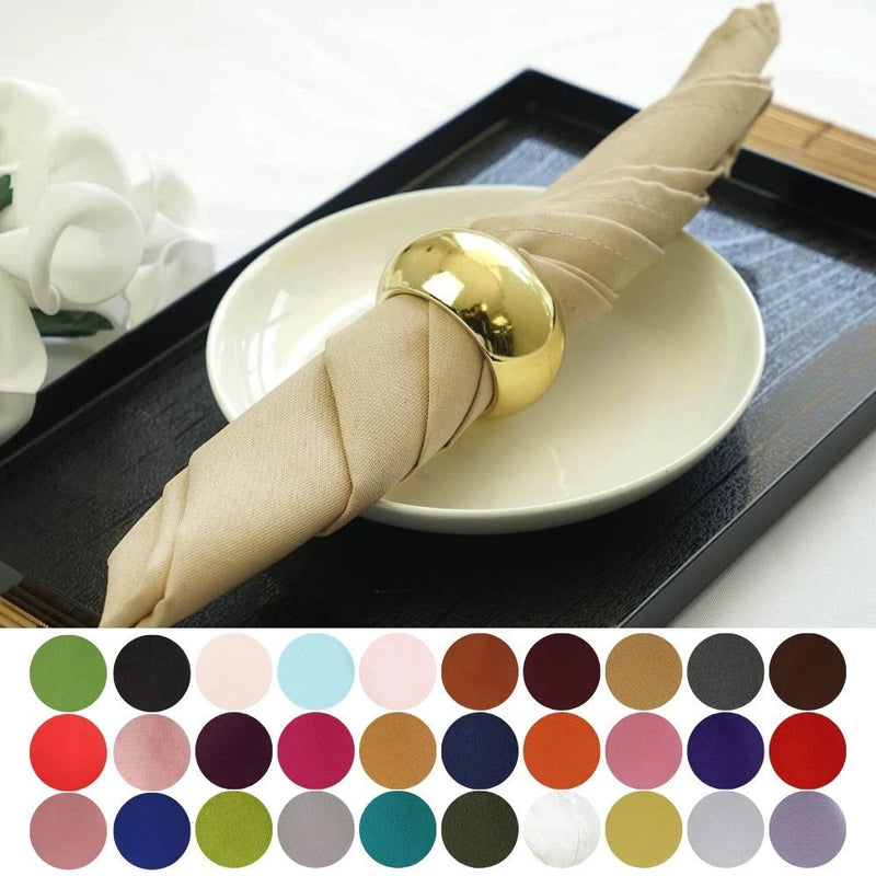 Beige polyester wedding table napkin with folded fabric and gold napkin ring