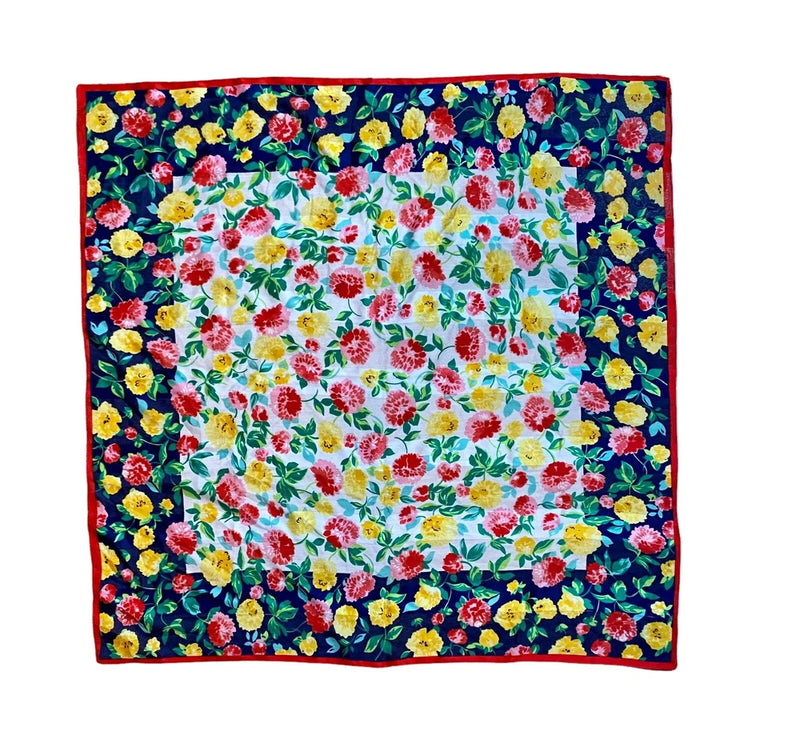 Bright floral square scarf with carnations in yellow, pink, blue, and red
