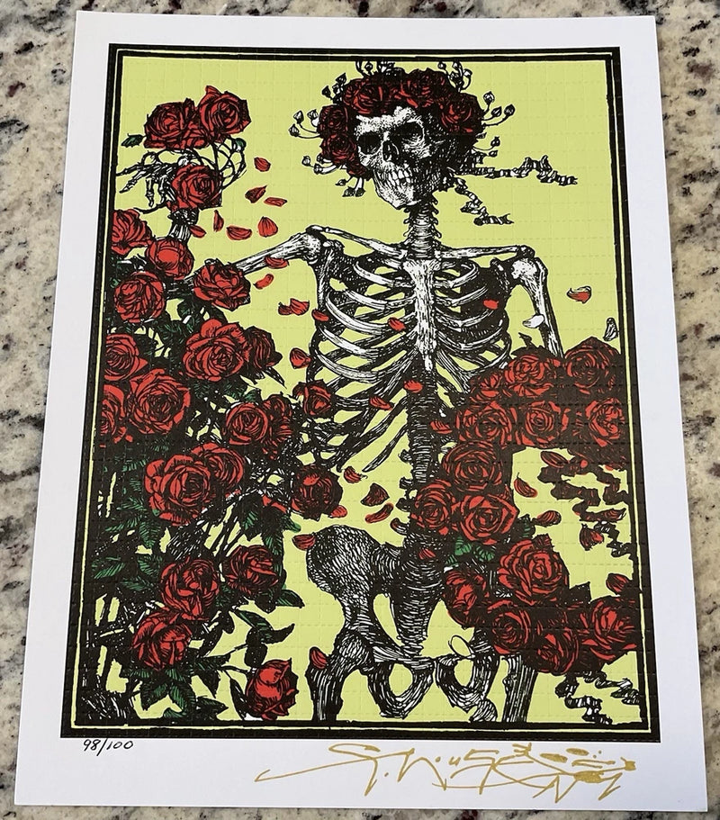 Signed skeleton and roses art print with green background, white frame border