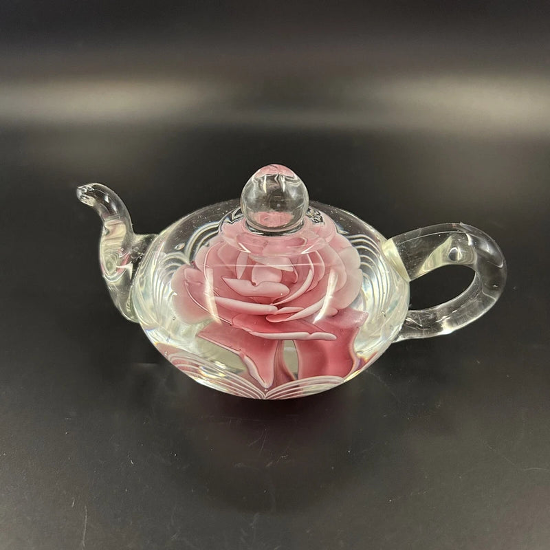 Blown glass teapot paperweight with pink carnation flower design, clear glass