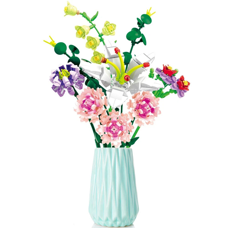 Artificial flower building block bouquet with pink carnations in light blue vase