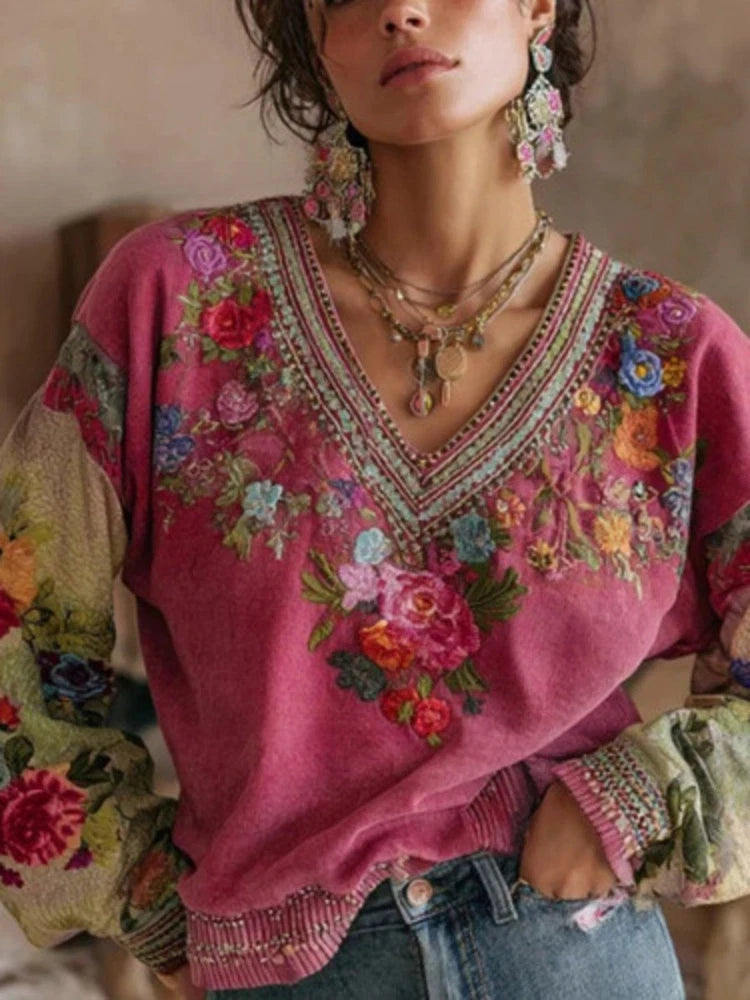 Purple floral embroidered V-neck blouse with short sleeves and decorative trim