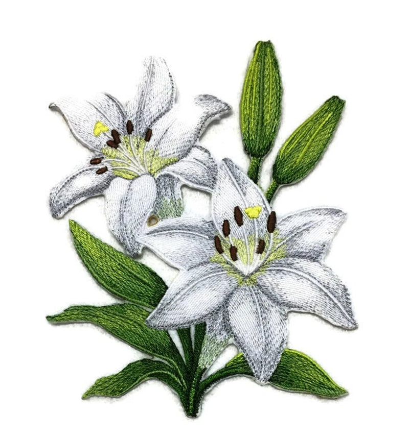 Embroidered white lily flower patch with green leaves, iron-on style