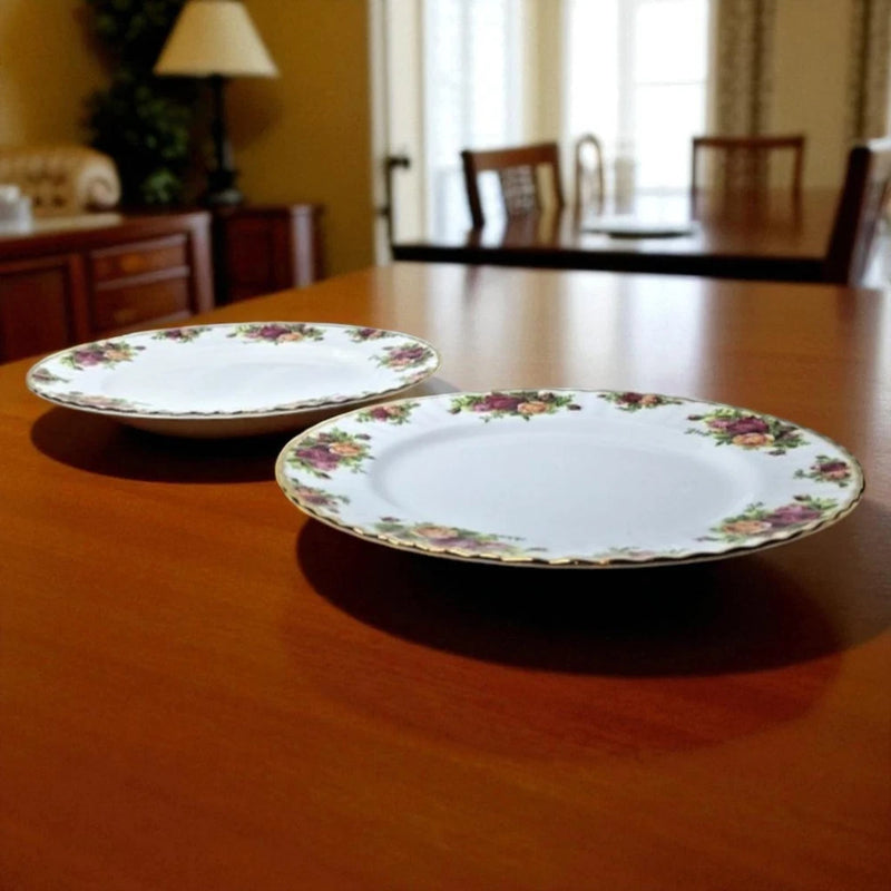 Pair of white bone china dinner plates with pink rose floral border
