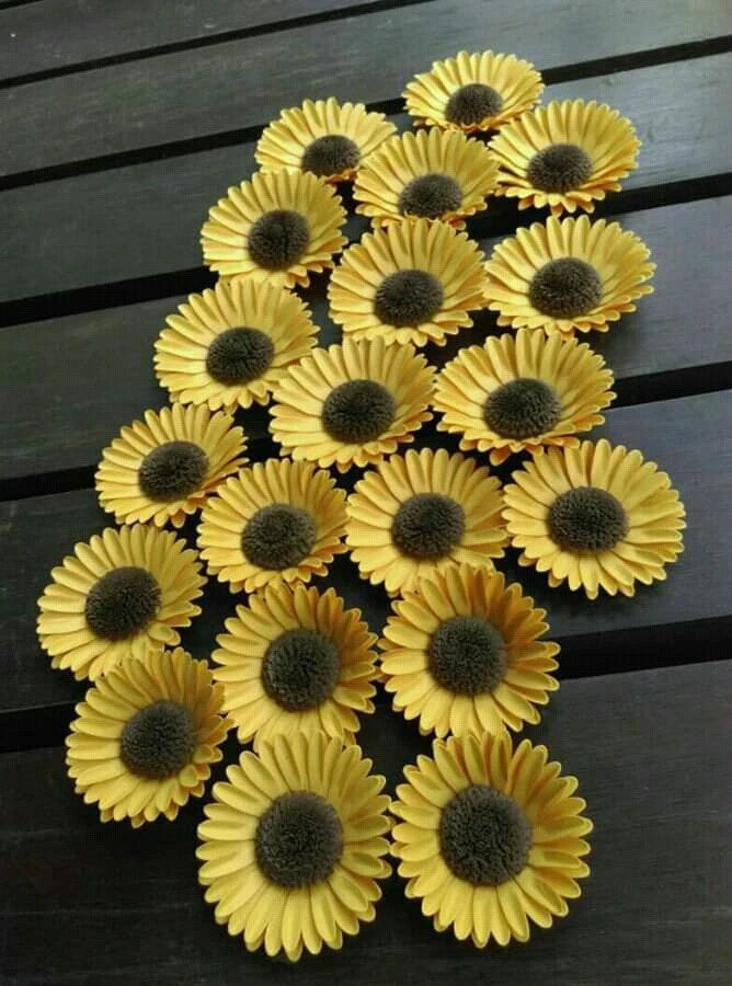 Yellow paper sunflower wall flowers with dark centers, set of decorative blooms