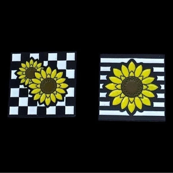 Sunflower pin set of two with yellow petals, black centers, and black-white checkered borders