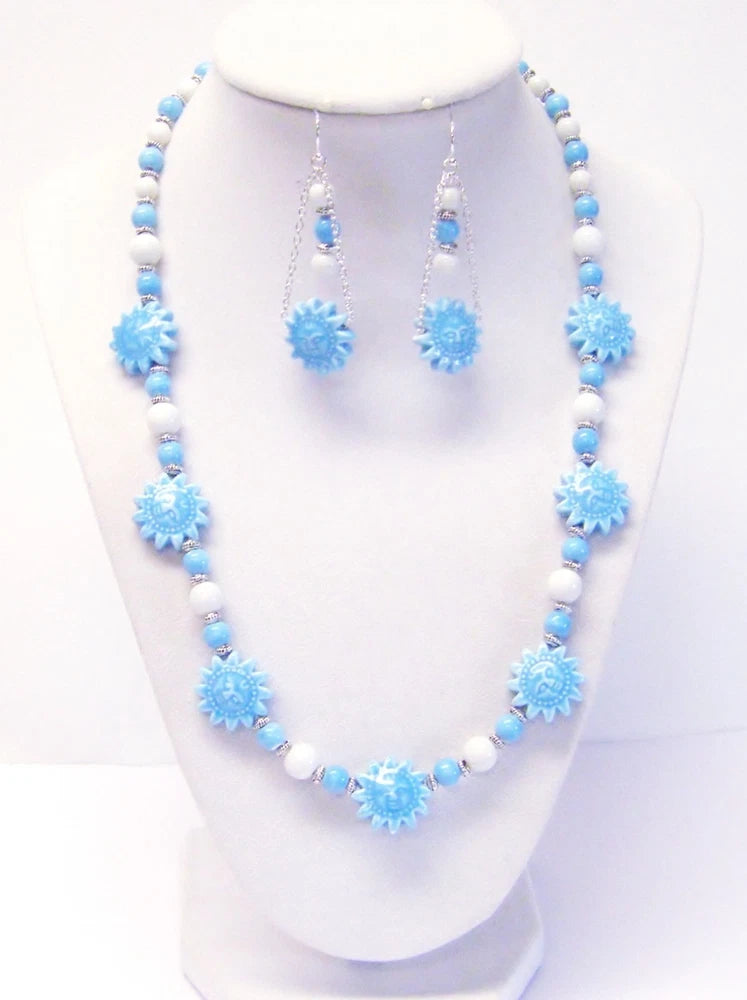 Blue beaded sunflower charm necklace with white bead links and matching drop earrings
