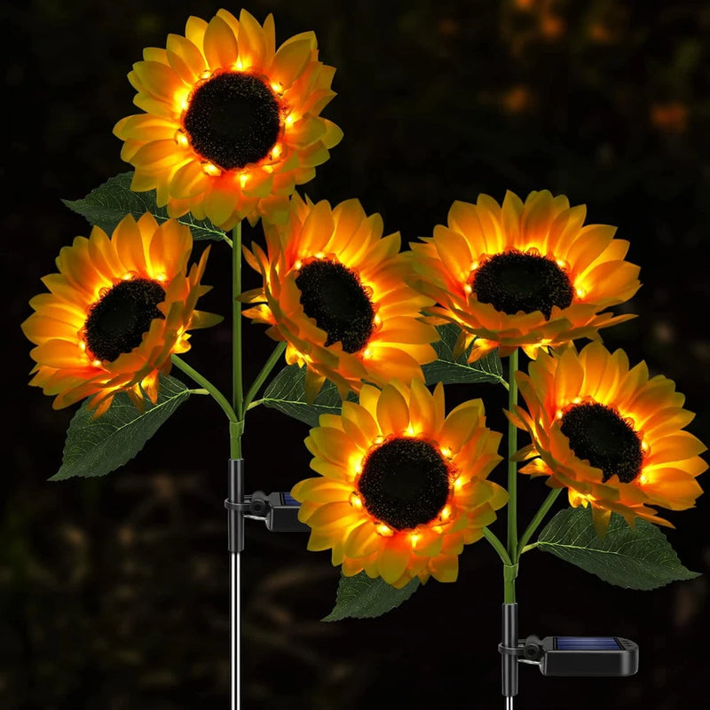 Solar garden sunflower lights with 5 glowing yellow blooms on metal stakes