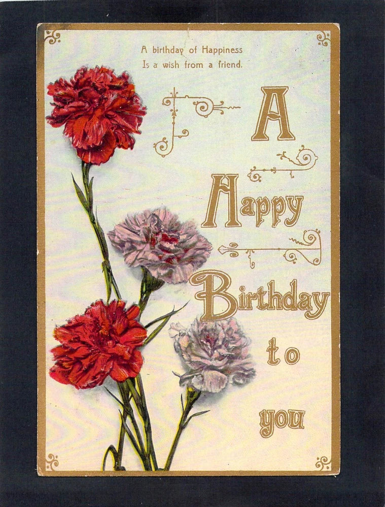 Vintage birthday postcard with red and pink carnations and ornate Happy Birthday text.
