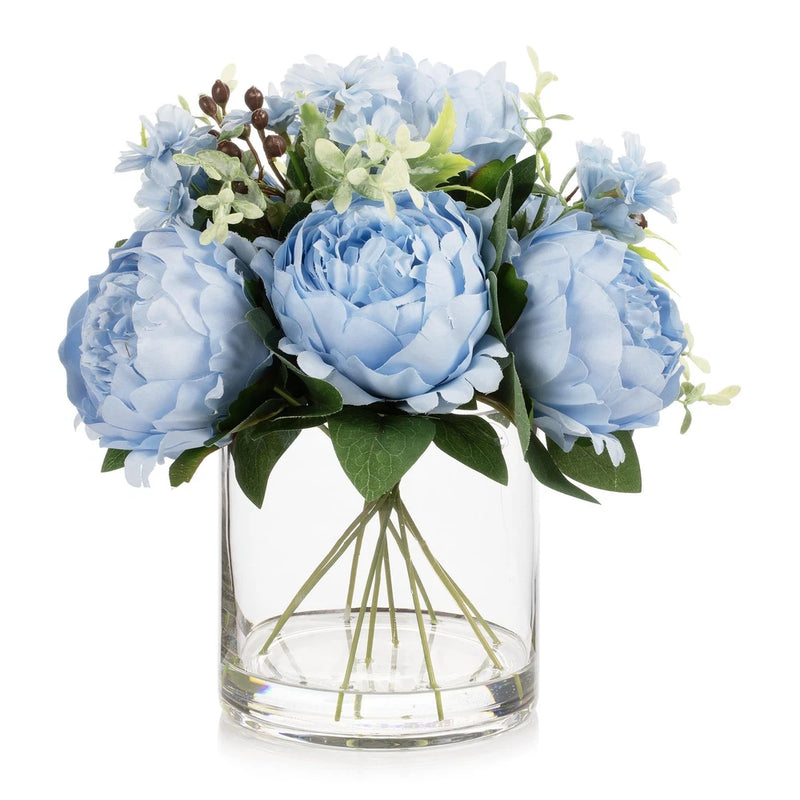 Light blue artificial peony flower arrangement in clear glass vase