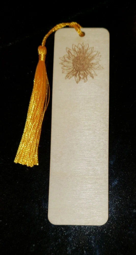 Wooden bookmark with laser-burned sunflower design and yellow tassel