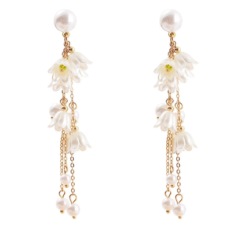 Gold-plated dangling flower earrings with white faux pearl beads and white blossoms